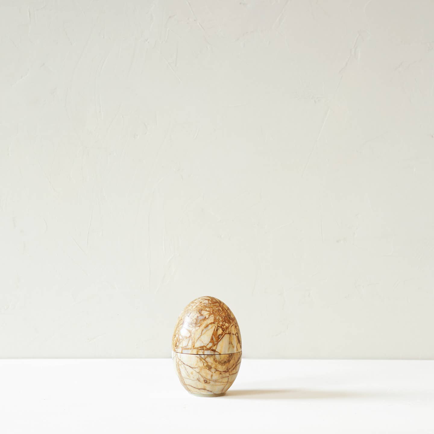 The Egg Grinder in Amber
